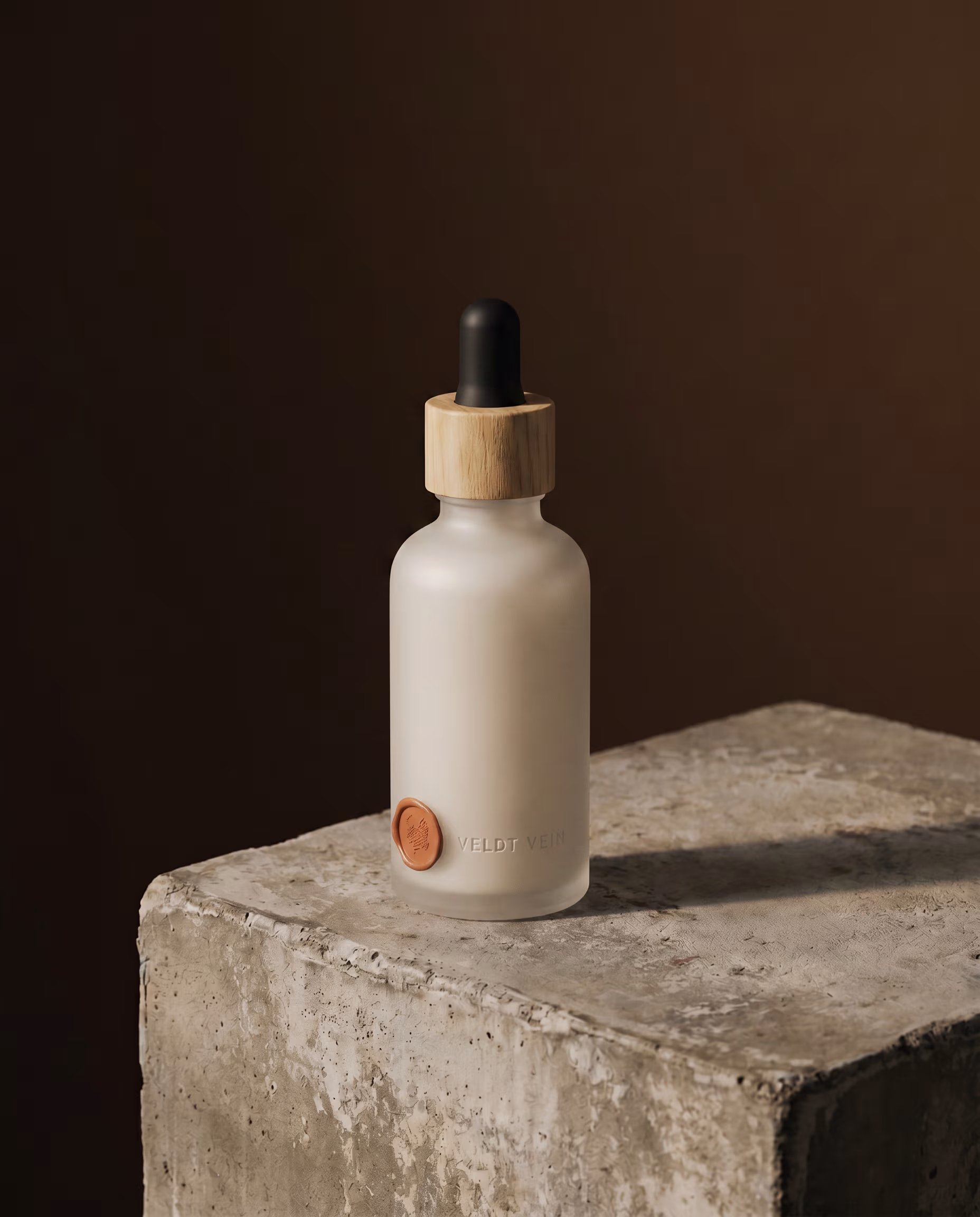 The Honeybush Neck & Décolletage Concentrate — frosted dropper bottle with beechwood collar and black rubber bulb.